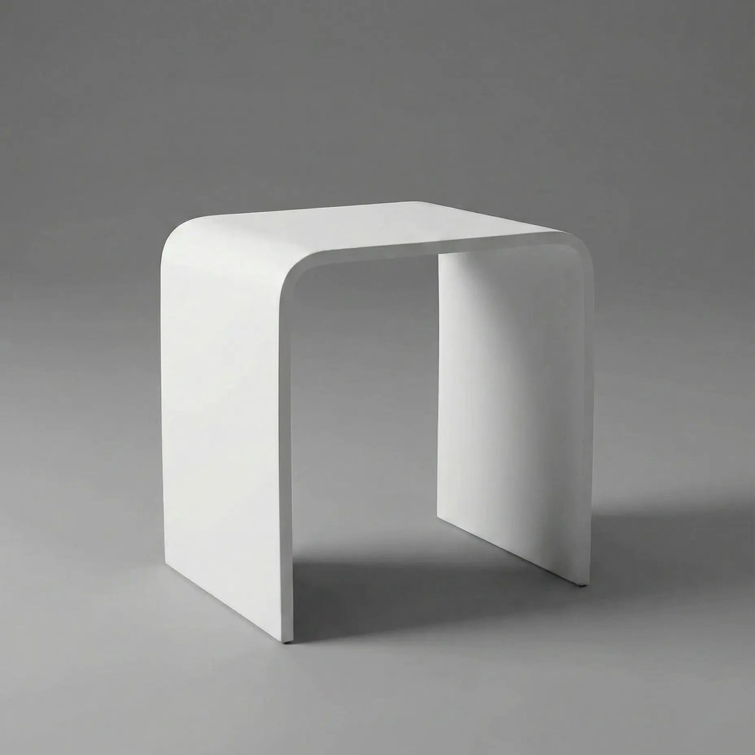 White stool on a gray background