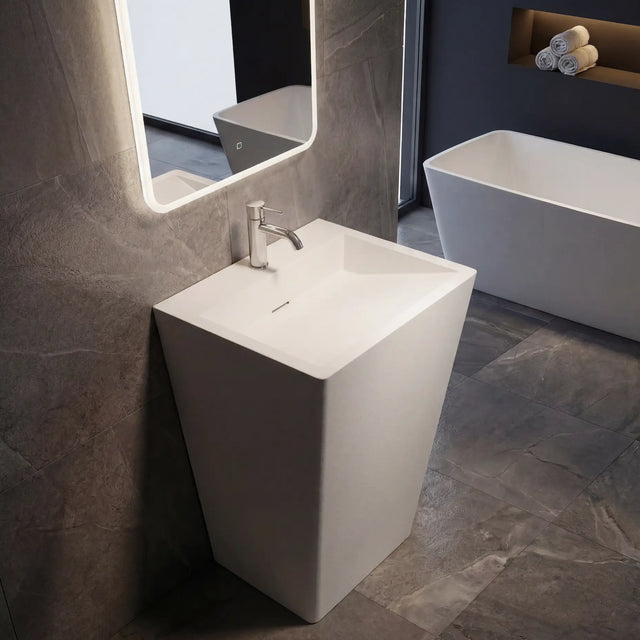 Modern bathroom with a freestanding sink and bathtub.