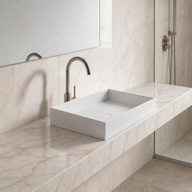 Modern bathroom with marble vanity and solid surfaces sink