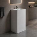 Modern bathroom with a freestanding sink and bathtub.