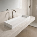 Modern bathroom sink with faucet in a marble-like setting