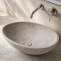 Bathroom vanity with a stone concrete sink and faucet