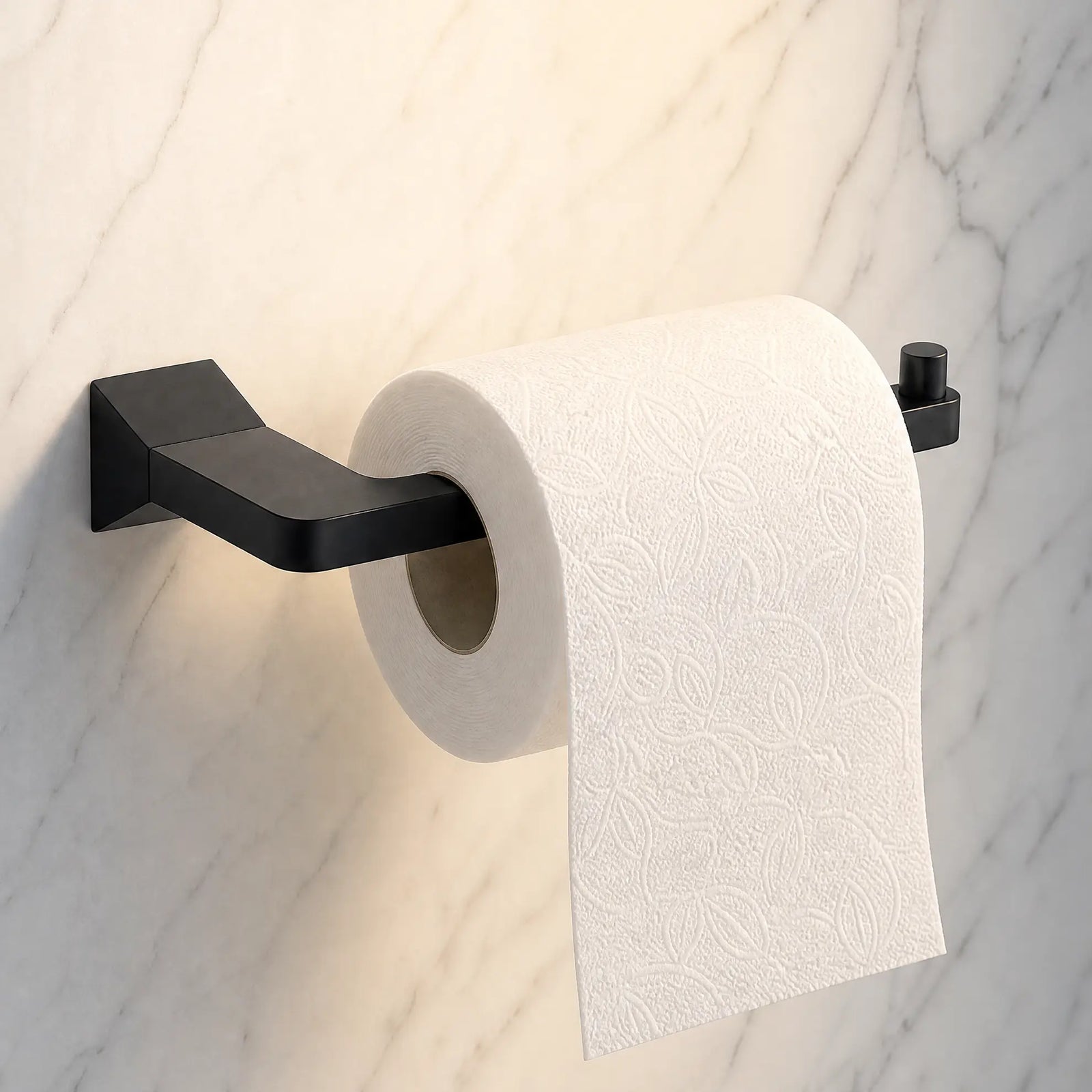Roll of toilet paper on a black wall-mounted holder against a marble wall.