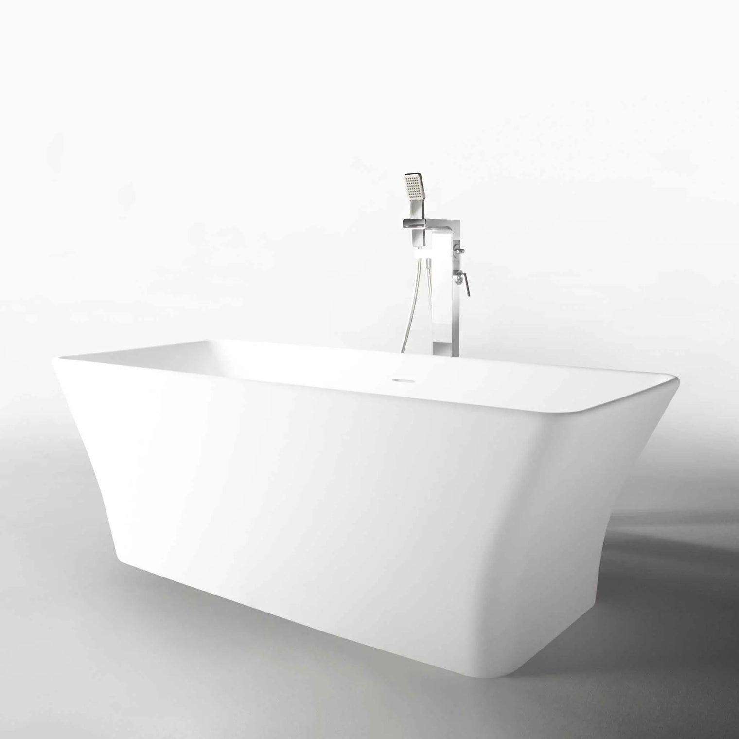 White freestanding Ragusa 165 bathtubs made of INFINITE Solid Surfaces with built-in overflow and pop-up drainage